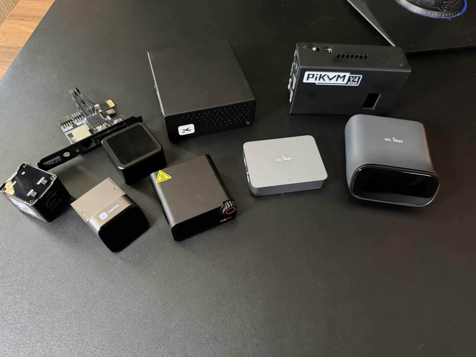 Lineup of popular IP KVM devices from different makers side by side