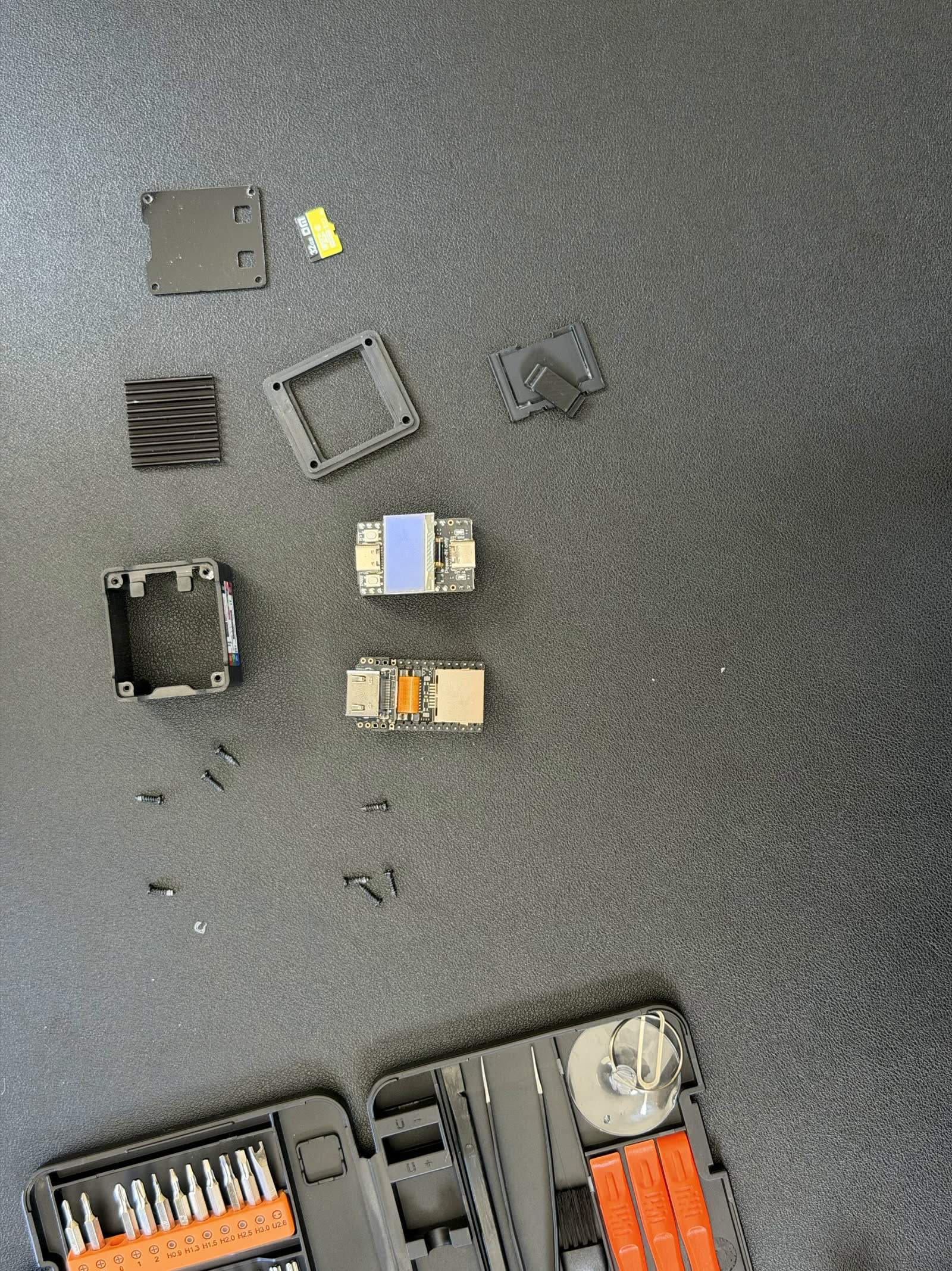 The NanoKVM Full opened, shell separated from the stacked board assembly.