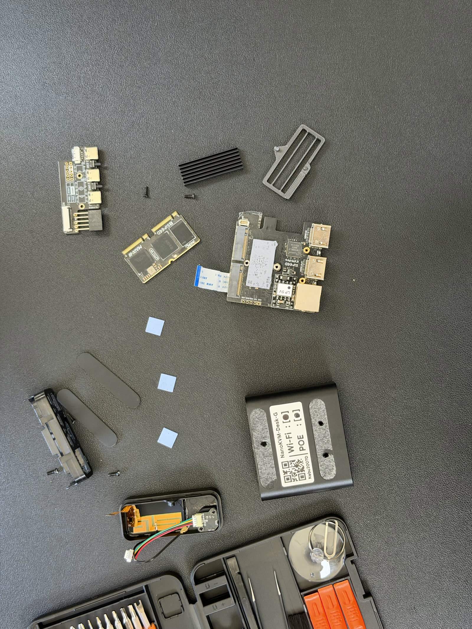 The NanoKVM Pro fully disassembled on the bench.