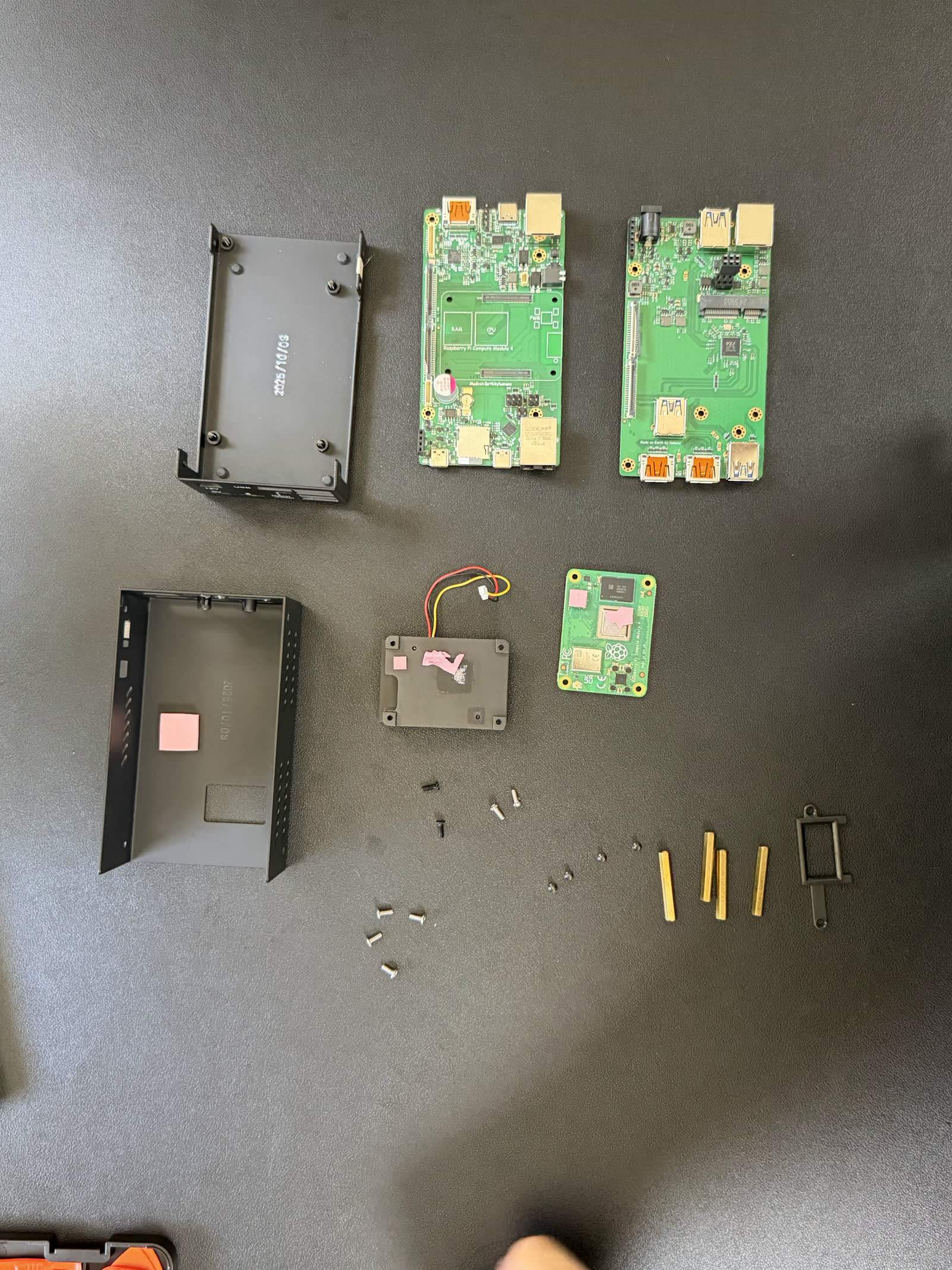 The PiKVM V4 Plus fully disassembled on the bench.