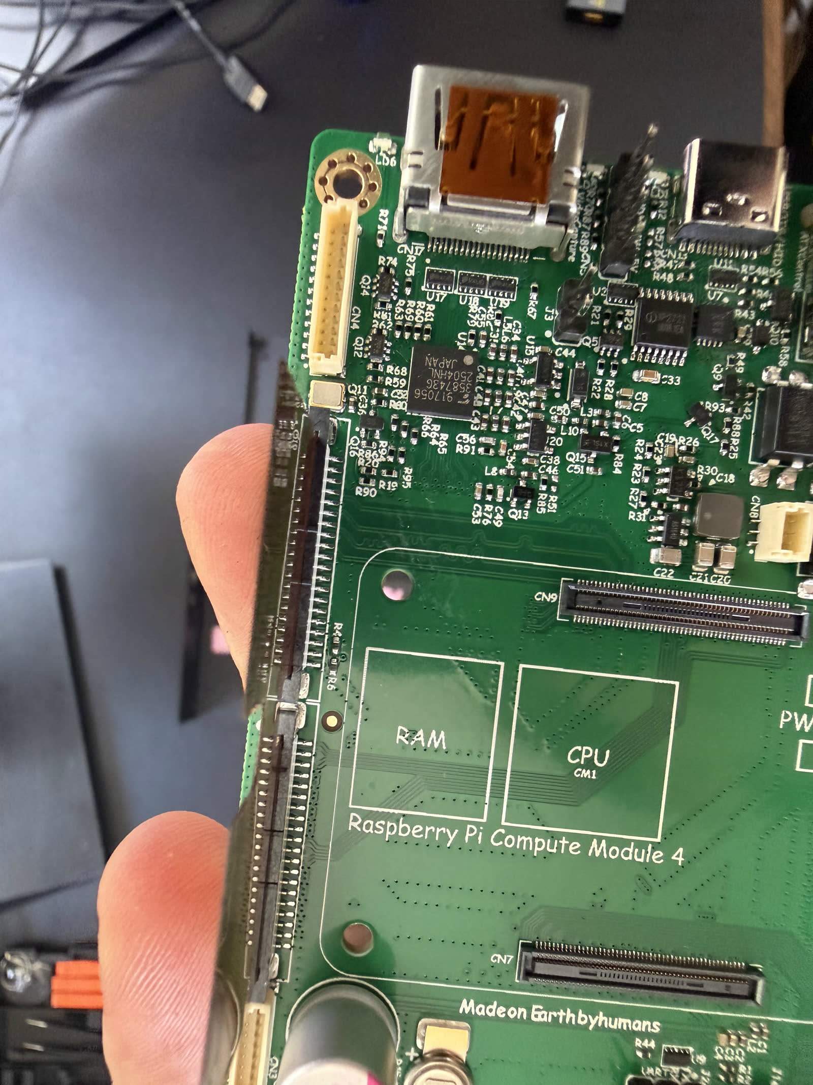 Macro of the Toshiba HDMI-to-CSI bridge on the PiKVM, the chip that sets its 1080p ceiling.