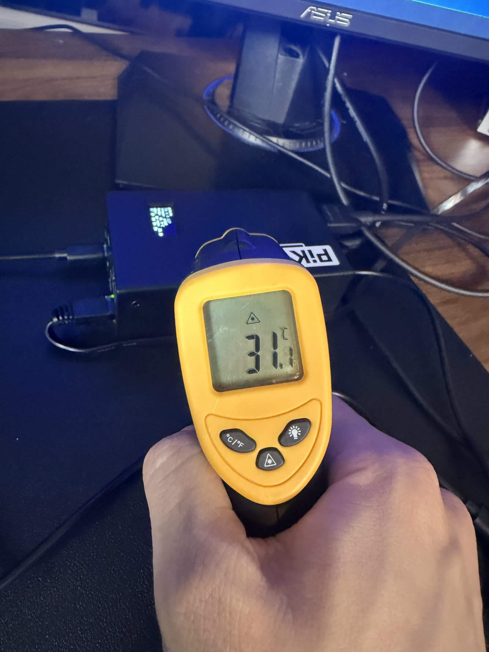 A thermal reading on the PiKVM's steel enclosure, which conducts heat away from the CM4.