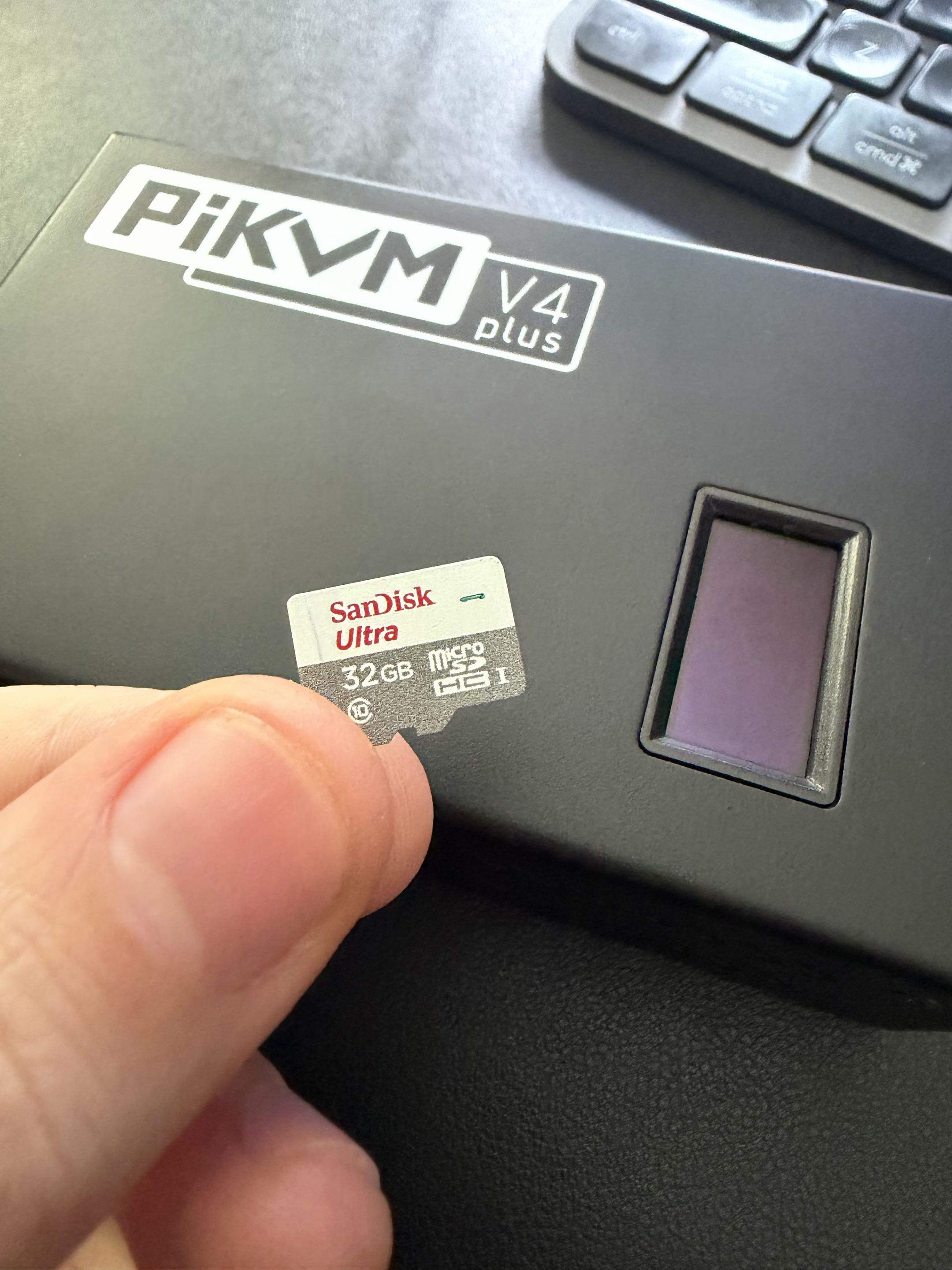 The PiKVM's removable, genuine SanDisk microSD, with the read-only root and dedicated virtual-media partition.