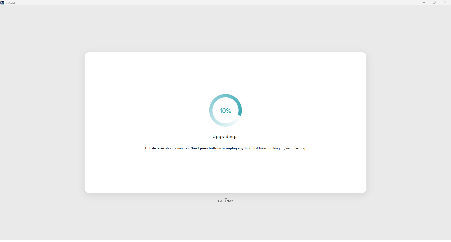 Screenshot or photo of the GL.iNet firmware updater hung at 99%, the recurring problem that stretched the base Comet's setup to nearly 23 minutes.