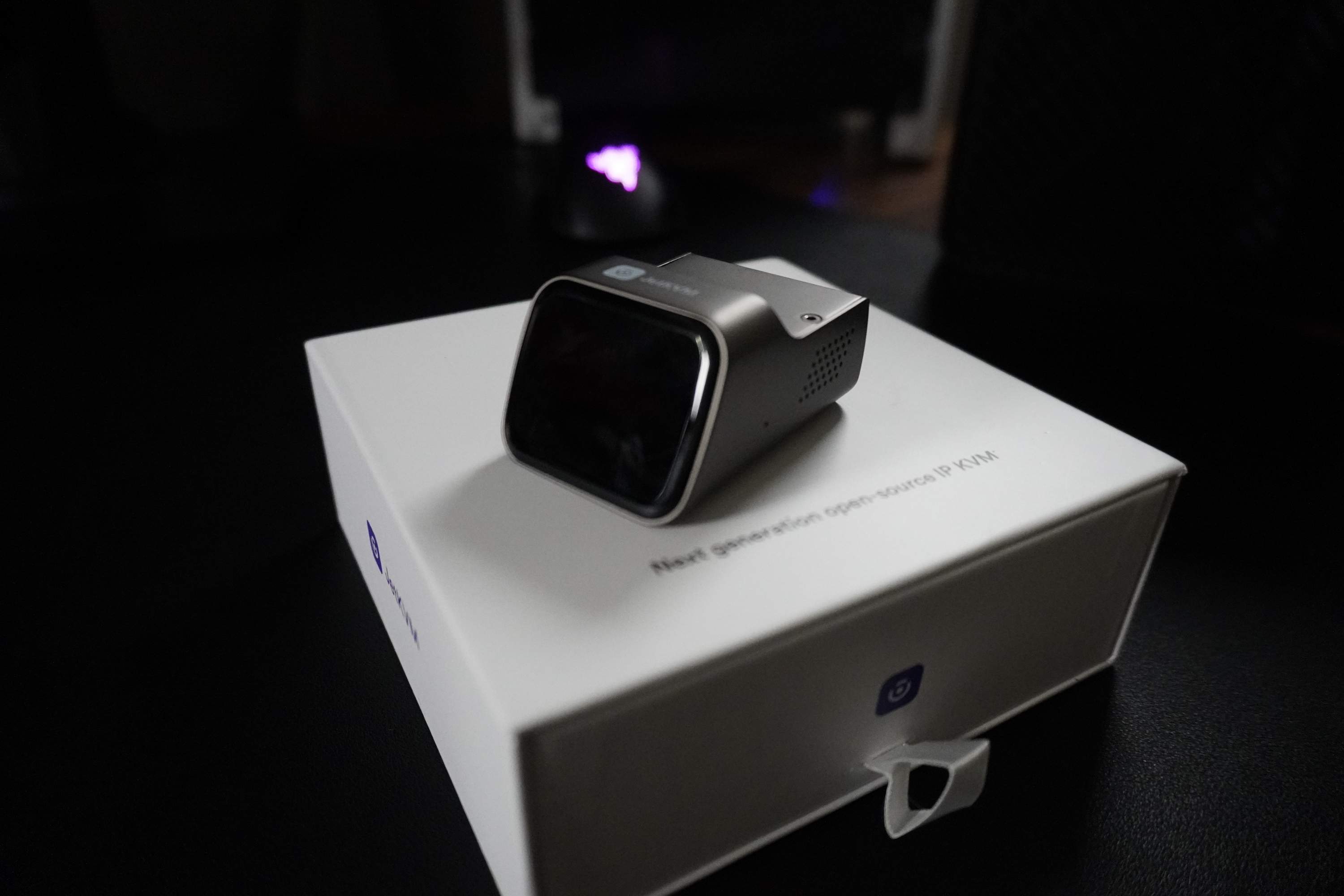 The JetKVM and its retail packaging, so buyers can recognise the genuine article.
