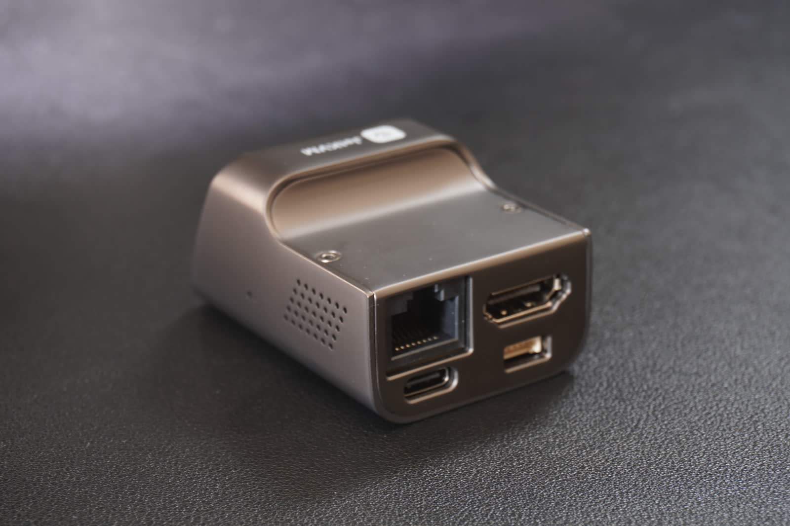 Rear view of JetKVM showing Ethernet, extension port, HDMI, and USB-C