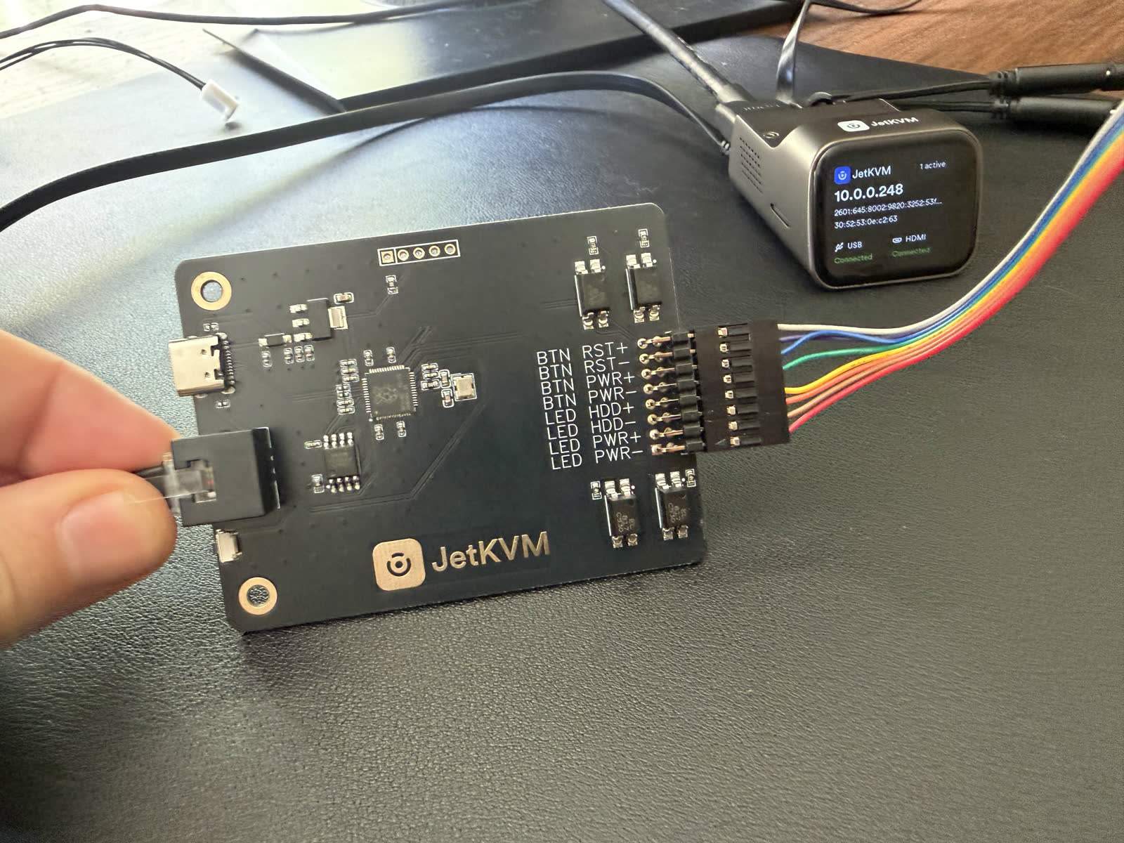The JetKVM wired to its ATX extension board for remote power control.
