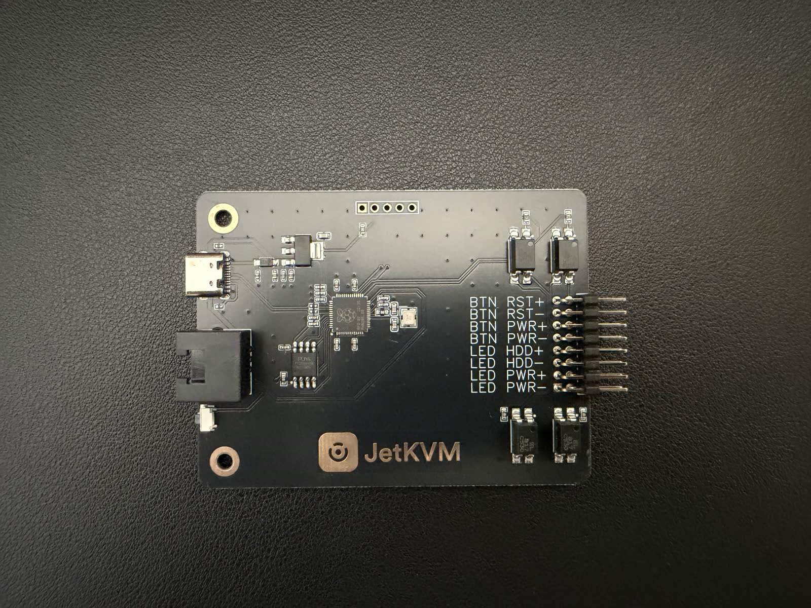 The JetKVM ATX extension board with the cable that links it to the JetKVM and the front-panel leads.